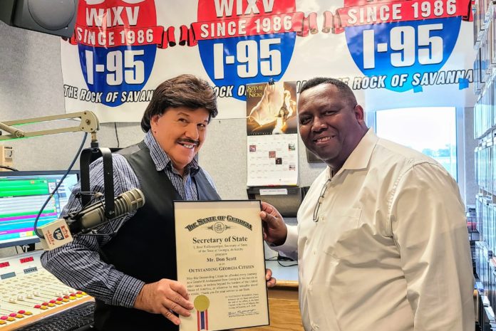 Don Scott (left) receiving his Outstanding Georgia Citizen Award in October 2020 from Representative Carl Gilliard.